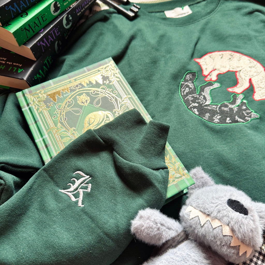 Green sweatshirt with K embroidered design.