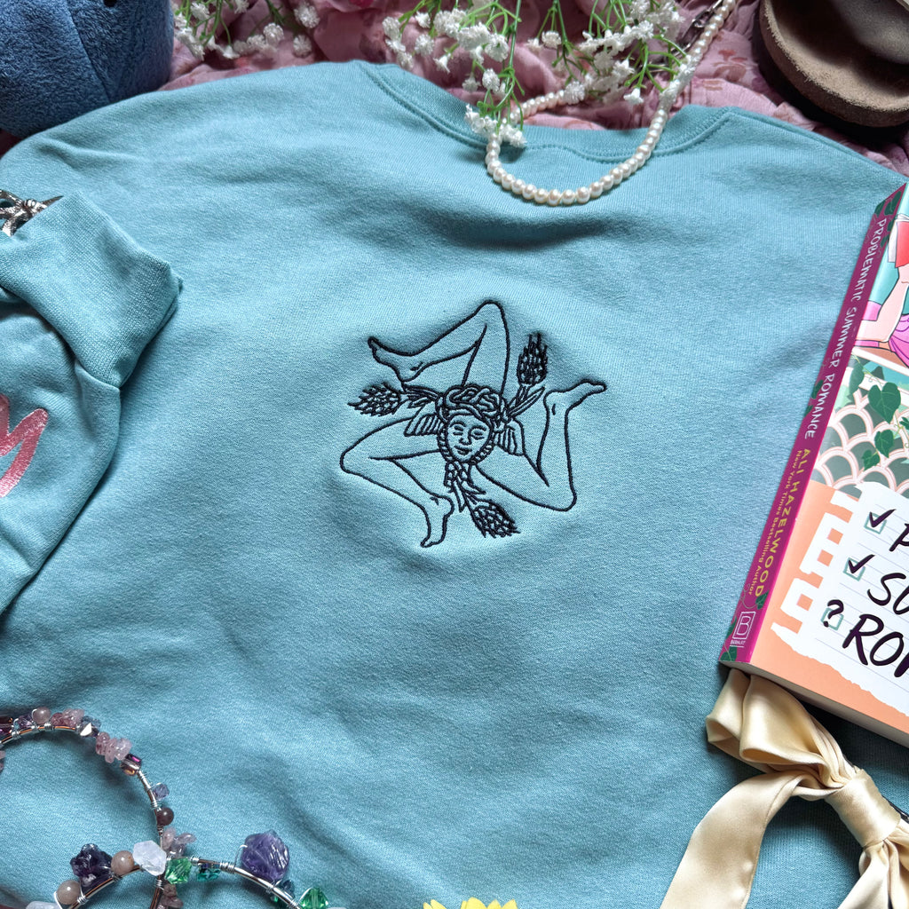 Teal sweatshirt with embroidered design based on Problematic Summer Romance by Ali Hazelwood.