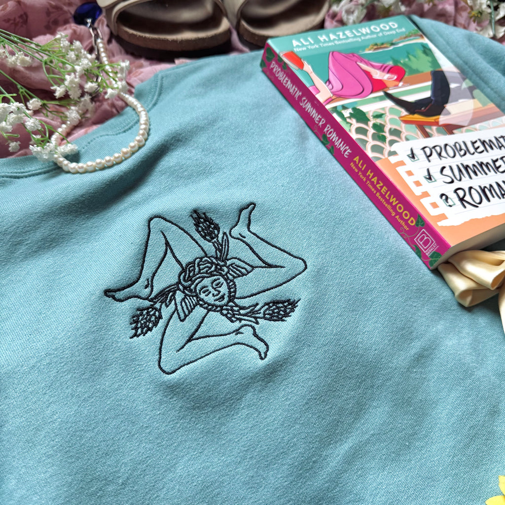 Teal sweatshirt with embroidered design based on Problematic Summer Romance by Ali Hazelwood.