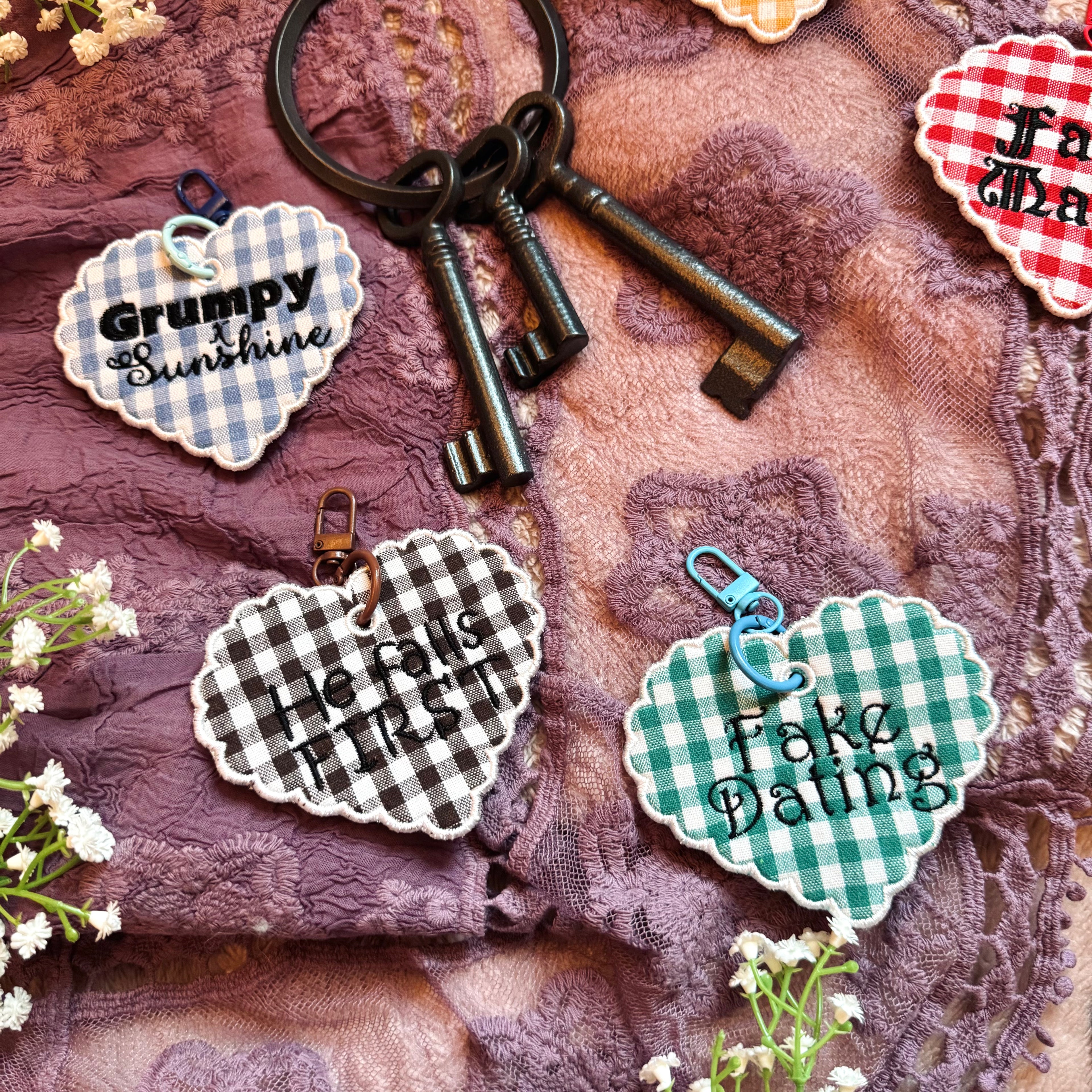 Keychain with decorative tags on a textured fabric background