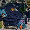 Navy crewneck with embroidered emblem of a mug shaped like an upside down beehive, and the words "The Bee Hive Café."